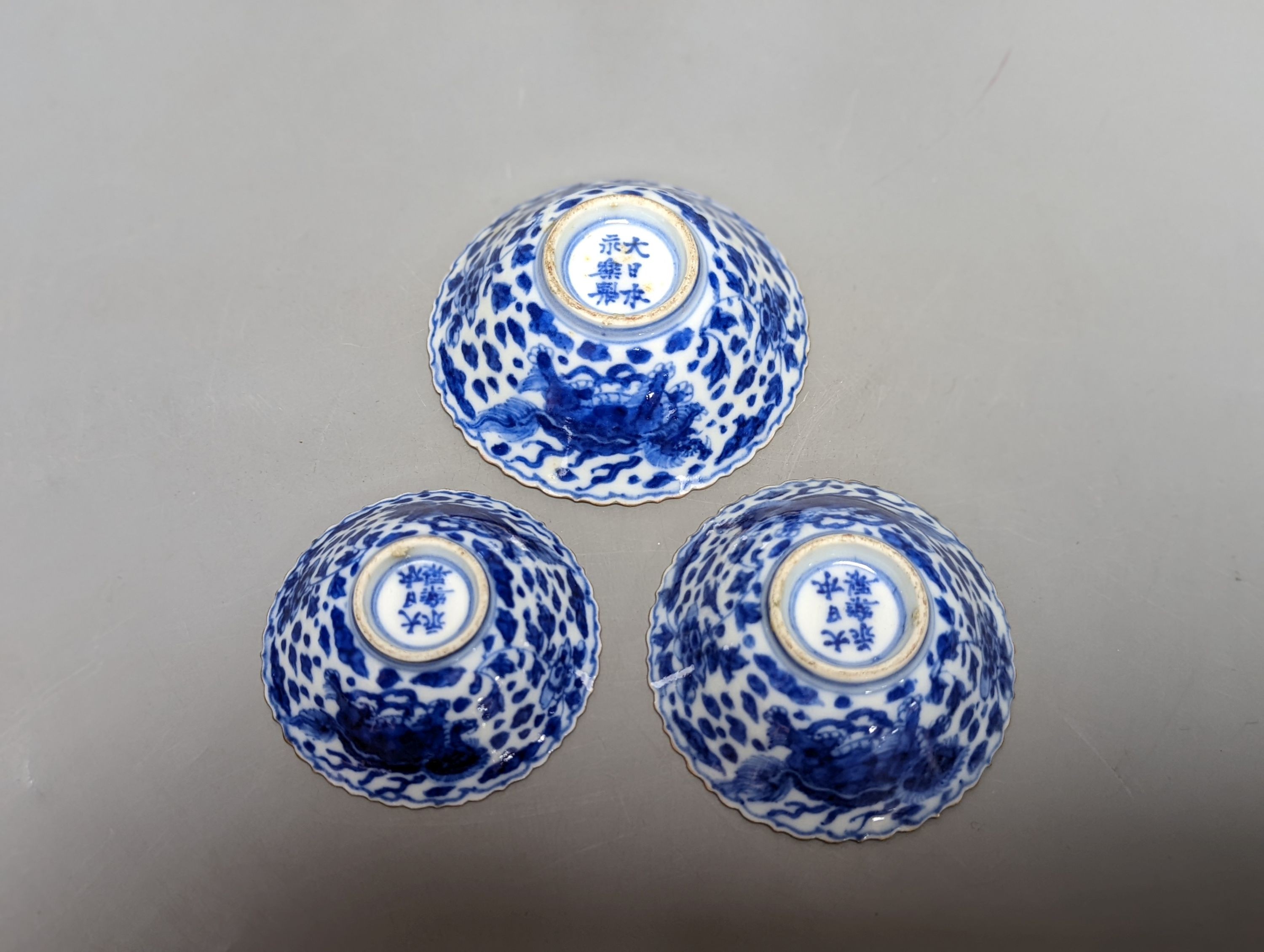 Three Japanese graduated porcelain miniature bowls, a pair of small Satsuma vases and another, pair of vases 12 cms high (6)